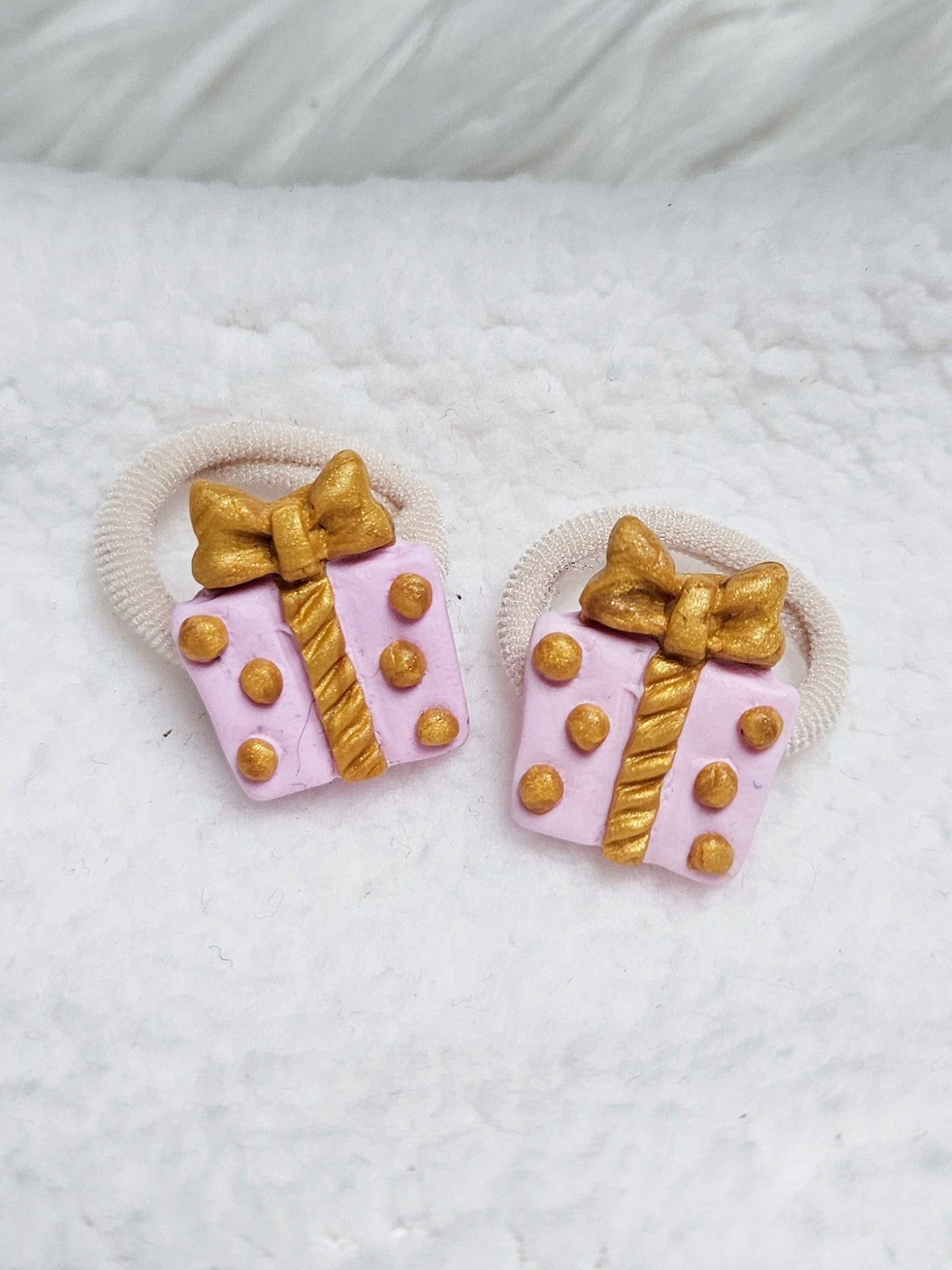 Mini of maxi elastiekjes - Pakjesavond roze/ goud