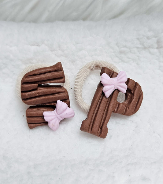 Mini of maxi elastiekjes - Chocoladeletters Roze