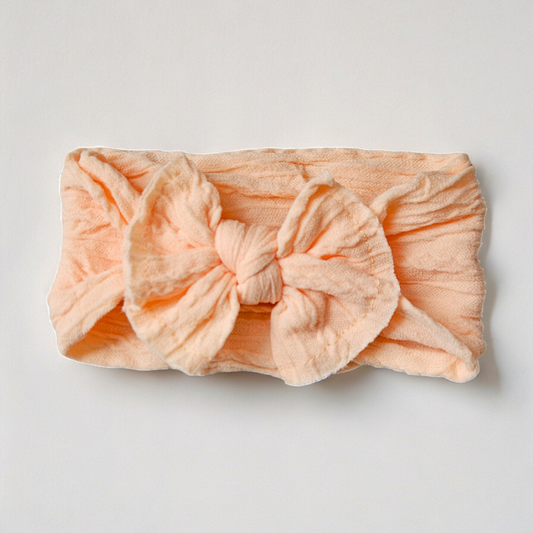 Knoop haarband - 𝑃𝑎𝑠𝑡𝑒𝑙 𝑜𝑟𝑎𝑛𝑗𝑒