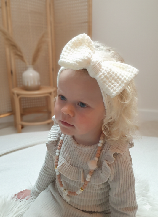 Gebreide haarband met strik - 𝐶𝑟𝑒𝑚𝑒